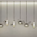 Modern Transparent Spherical Glass Chandeliers Hanging On White Wall With Soft Light