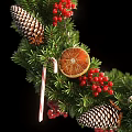 Christmas Wreath with Green Pine Branches Red Berries Pine Cones Orange Slices and Candy Canes