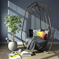 Indoor Hanging Chair With Metal Frame Woven Design Blue Cushion Colorful Pillows And Green Plant