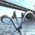 Silver Metallic Curved Landscape Sculpture On Water Surface With Bridge And Natural Scenic View