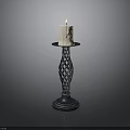 Lit Beige Candle On Decorative Braided Metal Candlestick Stand With Smooth Base