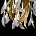Gold and Silver Feather Shaped Chandelier Hanging Illuminated in Black Background