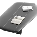 Black Leather Coffee Table With Stitched Surface And Open Closed Books