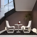 White Modern Chairs And Round Table Setup With Red Bottle Green Plant Black Pebble Floor