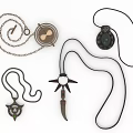 Unique Jewelry Collection Featuring Various Pendant Necklaces With Metal Chains And Black Cords