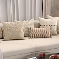 Neutral Toned Decorative Throw Pillows With Various Textures On Beige Sofa Living Room