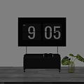 Large Digital Clock On White Wall With Black TV Stand And Green Plant In Vase