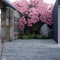 Pink Cherry Blossom Tree Clothing Store Entrance With Wooden Structure And Stone Path