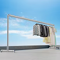 Outdoor Metal Clothes Rack With Hanging Clothes On Balcony Under Blue Sky