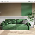 Elegant Green Velvet Two Seater Sofa with Floor Lamp Green Wall Art and Potted Plant