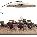 Outdoor Table With Arched Umbrella Black Chairs On Wooden Deck And Decorations
