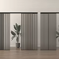 Black Vertical Sliding Doors in Interior with Wooden Floor and Green Plants
