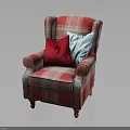 Plaid Upholstered Armchair With Red And Blue Pillows And Wooden Legs