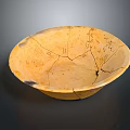 Yellowish Clay Carved Pottery Bowl With Surface Cracks And Intricate Patterns