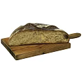 Freshly Baked Artisan Bread with Crusty Exterior on Wooden Cutting Board