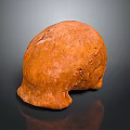 Detailed Orange Animal Skull With Natural Textured Surface On Dark Background