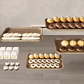 Assorted Baked Goods Including Baguettes Glazed Donuts And Pastries On Wooden Trays