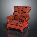 Red Upholstered Armchair With Patterned Fabric And Carved Wooden Legs