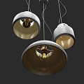 Three Modern Pendant Lights With Round Metal Shades For Interior Lighting Design