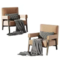 Modern Beige Armchair with Black and White Checkered Pillow Gray Blanket and Dark Wooden Legs