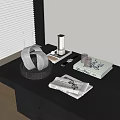 Elegant White Inflatable Model Display on Black Table with Decorative Books and Towels