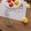 Modern Tea Set On Wooden Table With Open Book Fresh Fruits And Glass Cup