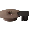 Round Walnut Wood Coffee Table And Black Side Table With Red Fruit Plate