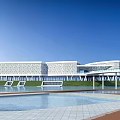 Modern Museum Building Featuring Geometric Facade Glass Elements Waterfront And Lawn 3d model