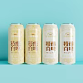 Craft Wheat Beer Yellow Cans With Chinese Labels On Light Blue Background