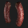 Two Cured Sausages With Textured Surface And Visible White Fat Particles