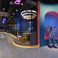 Modern Restaurant Interior With Neon Lights Colorful Seats And Art Sculptures Design