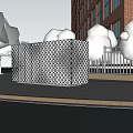 Industrial Equipment Featuring White Perforated Design Installed Outdoors Near Brick Building Trees And Metal Fence