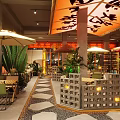 Restaurant Interior Featuring Red Canopy Black Characters Green Plants And Stone Slab Flooring