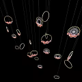 Stylish Decorative Hanging Ornament With Circular Rings And Floral Patterns On Black Background