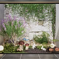 Courtyard Garden With Stone Wall Covered In Ivy Purple Flowers And Decorative Ornaments