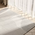 Light Gray Square Rug With Wavy Texture On Wooden Floor Under Sunlight And White Curtains