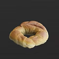 Freshly Baked Golden Ring Shaped Bread With Crusty Surface And Soft Inside
