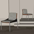 Modern Dining Chairs Featuring Grey Fabric Seats Wooden Backrests Black Frames And Metal Legs