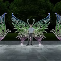 Photo Check In Spot With Butterfly Shaped Illuminated Decorations Night Green Trees And Stone Path