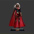 Female Superhero Statue With Green Blue Top Red Cape Boots Gold Details And Black Base