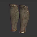 Antique Bronze Greaves With Intricate Carved Patterns On Black Reflective Surface