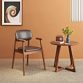 Wooden Dining Chair With Black Leather Back And Seat Armrests Round Table Green Plant