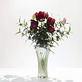 Ceramic Vase With Vertical Stripes Red Pink Roses Green Leaves On White Table