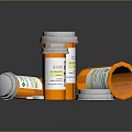 Orange Prescription Bottles With White Caps And Labels Standing Overturned On Dark Surface