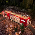 Red Container Building at Night with Outdoor String Lights Plants and Patio Furniture