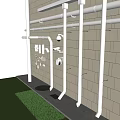 White Pipes with Fittings Elbows Tees Caps on Gray Brick Wall with Drain and Lawn