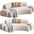 Cozy Beige Curved Bouclé Sectional Sofa With Checkered Tan Pillows And Soft Throw Blanket