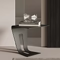 Modern Black Side Table With Curved Frame Stacked Books And Clear Glass Decor