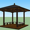 Outdoor Wooden Pavilion With Black Roof Benches And Table In Green Landscape Under Blue Sky