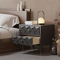 Modern Black Nightstand With Diamond Shaped Drawers Lamp And Stack Of Books